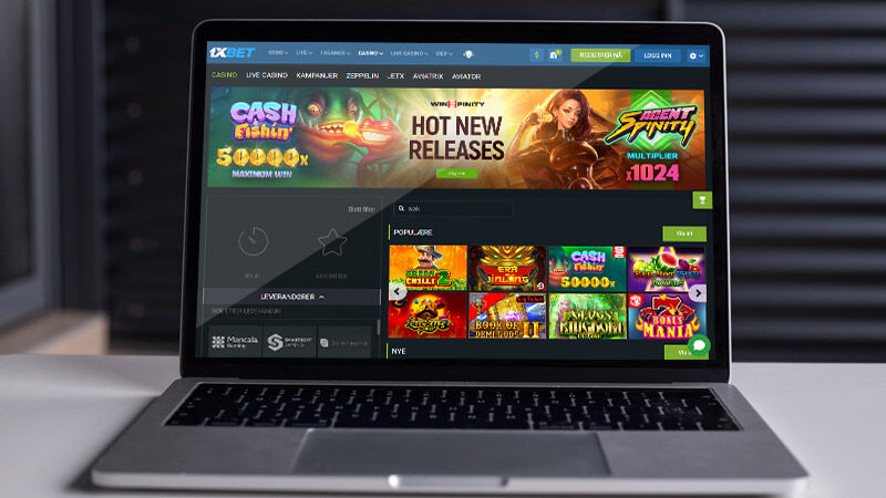 Hovedsiden til 1xBet Casino på skjermen til bærbar datamaskin